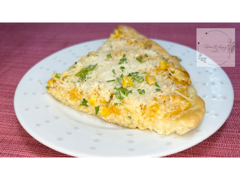 A crispy Mexican Corn Cheese Pizza topped with grilled corn, cheese, and fresh herbs.