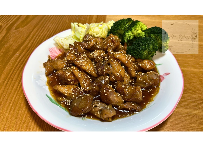 Juicy teriyaki chicken thighs glazed in sweet-savory sauce, served with sesame seeds and vegetables