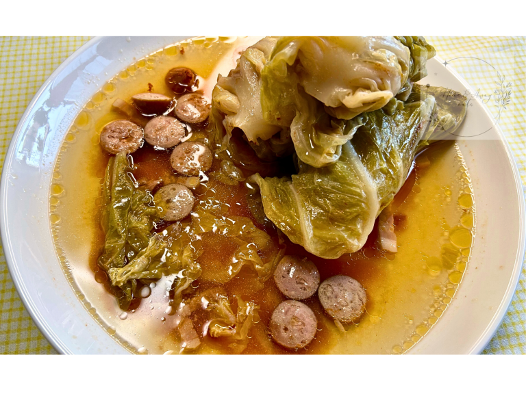 A plate of Sarma—Balkan cabbage rolls stuffed with meat and rice, served hot