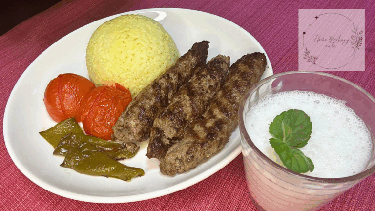 Close up of Persian Kabob Koobideh served with saffron rice and vegetables.