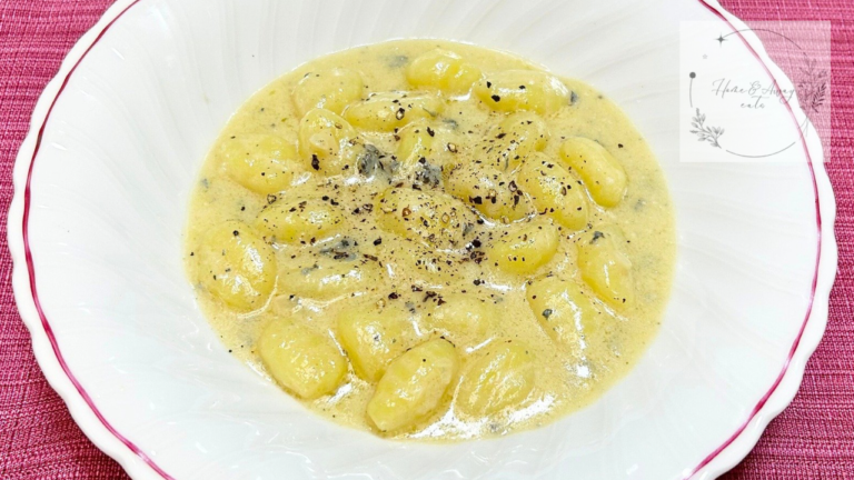 Close up of creamy gorgonzola gnocchi coated in cheese sauce
